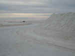 The park rangers at White Sands plow sand off the roads like plowing snow