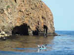 Kayakers near one of the sea caves