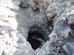 Snow at the bootom of a hole in the lava