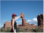 Janice supporting Balanced Rock, Arches National Park